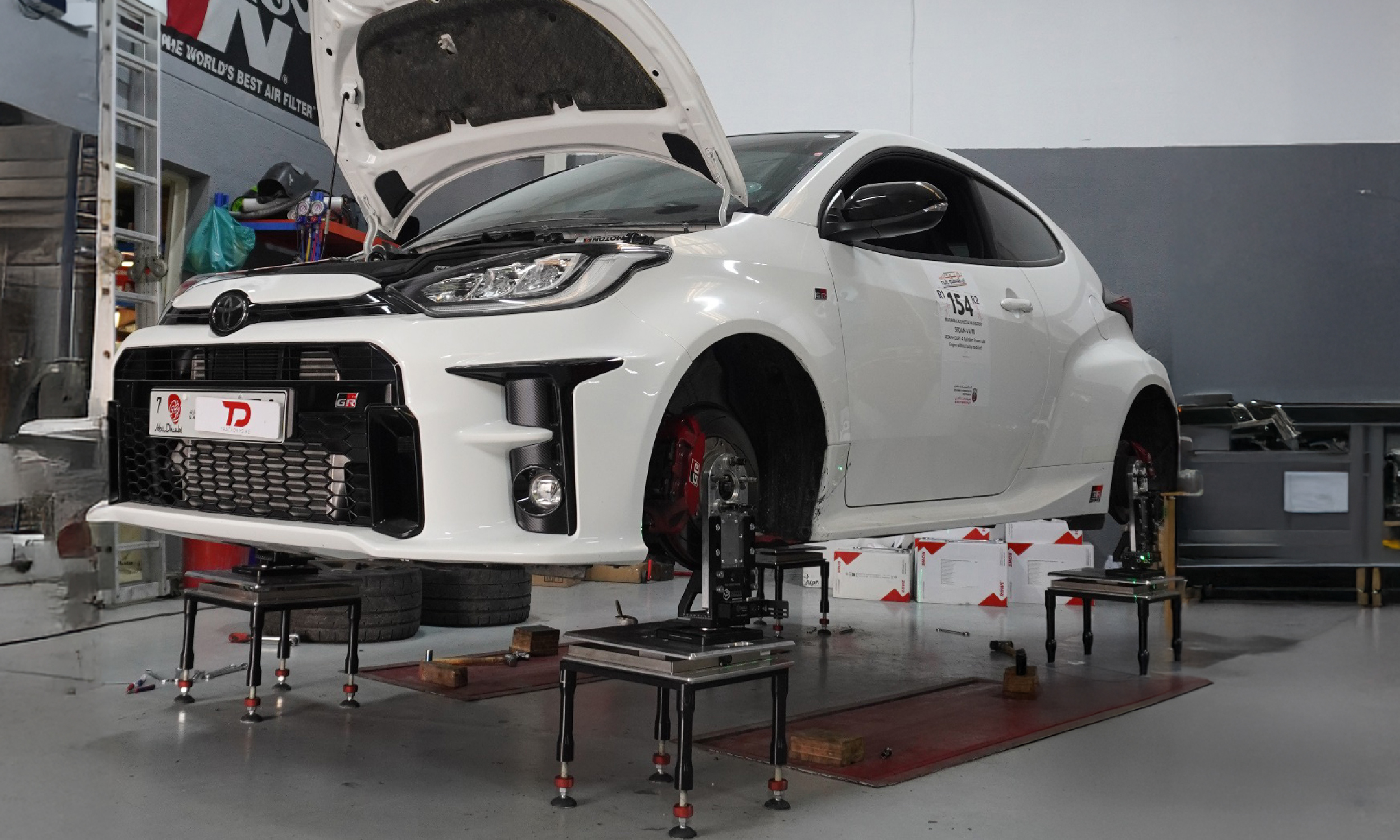 Technician inspecting underbody on lift